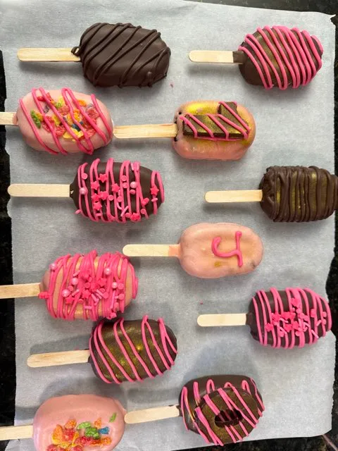 Berry-pink cakesicle batch fresh dipped