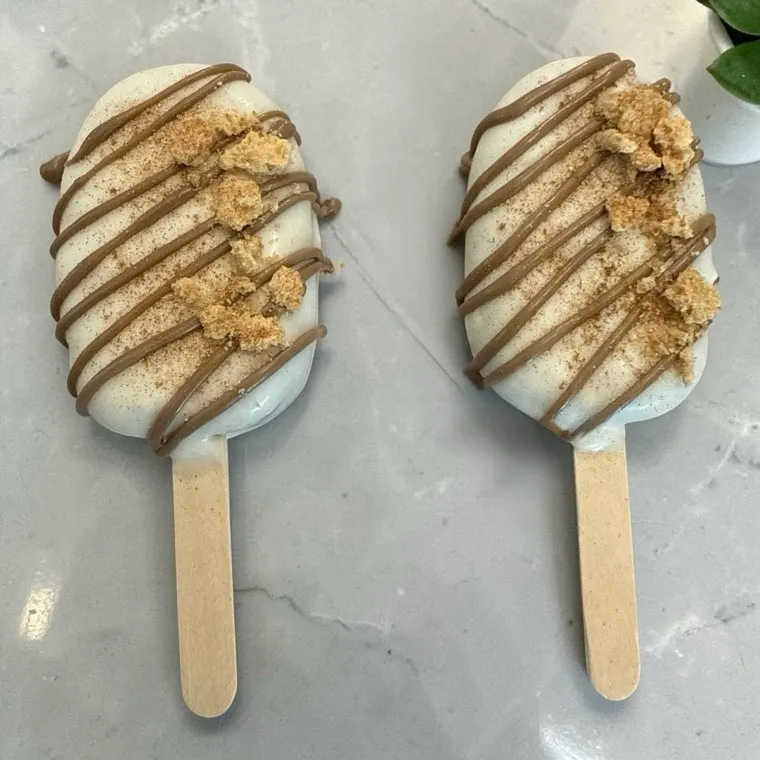 Two Butter Believe It cakesicles on marble