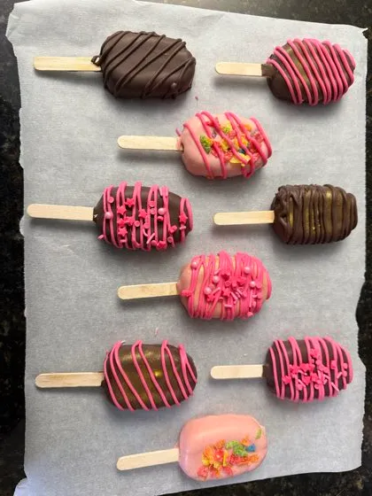 Pink and chocolate cakesicles with sprinkles